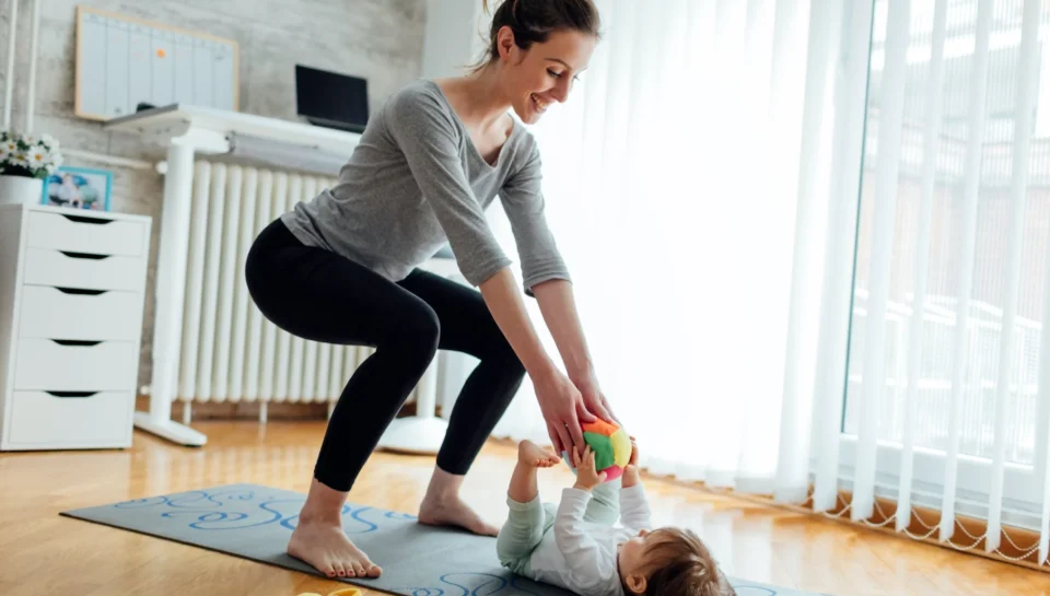 Post Partum Physiotherapy Baby Woman doing post partum physiotherapy with her baby